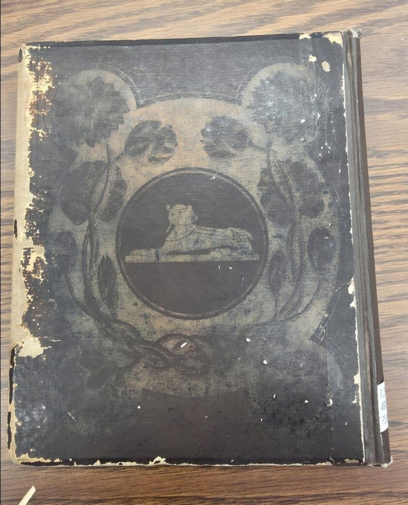 C067 original brown-and-gold publisher-issued rear board with sphinx design