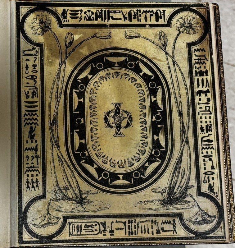 C074 original cream decorated front cover preserved within the later binding