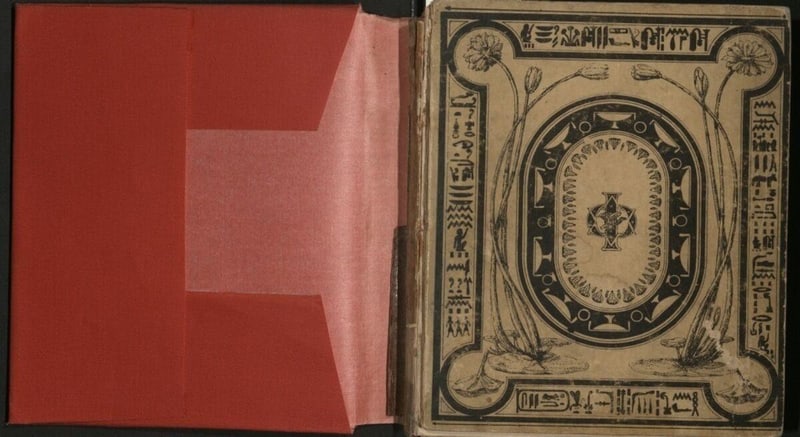 C043 Red protective cover opened to show the book